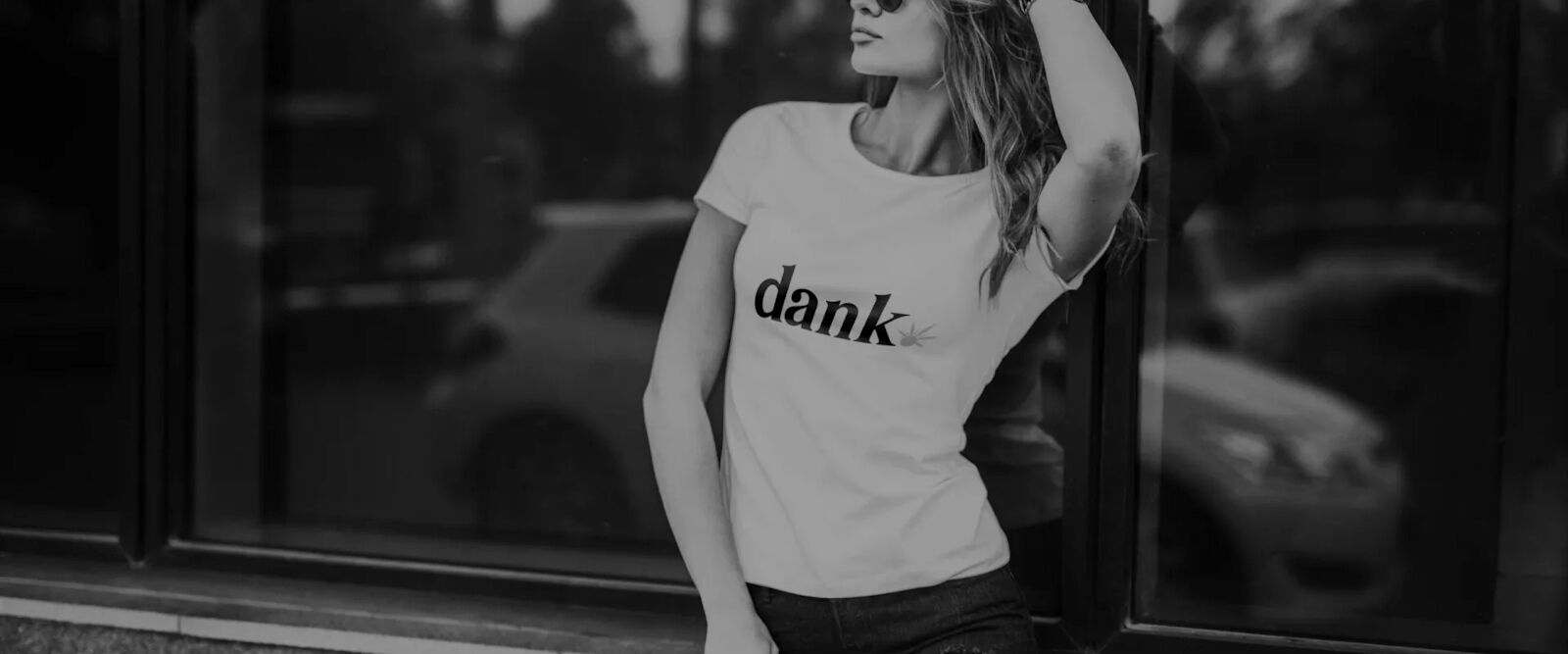 Dank Seeds Bank woman model with DANK logo t-shirt & sunglasses.